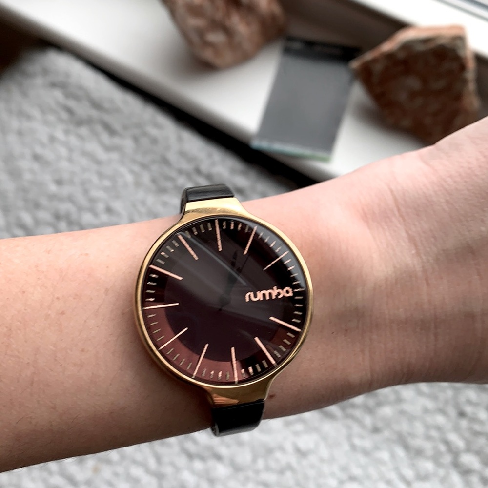 Black and gold rumba watch